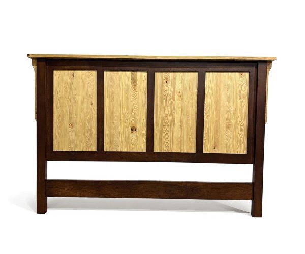 Wooden cabinet with a dark brown frame and light wood panel doors, standing on a white background.