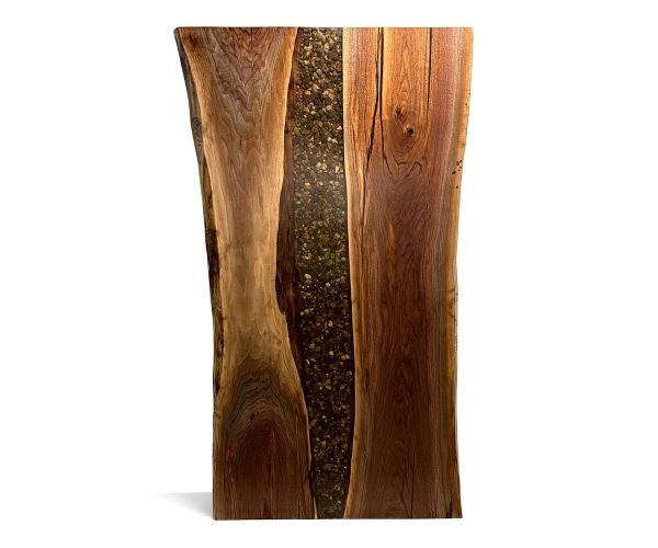 Vertical live-edge wooden slab with a dark pebble-filled groove running down the center.