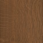 Close-up of a warm brown wood surface with vertical grain patterns and subtle knots.