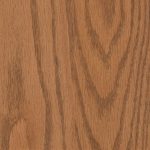 Close-up of oak wood grain with warm brown tones and visible lines.